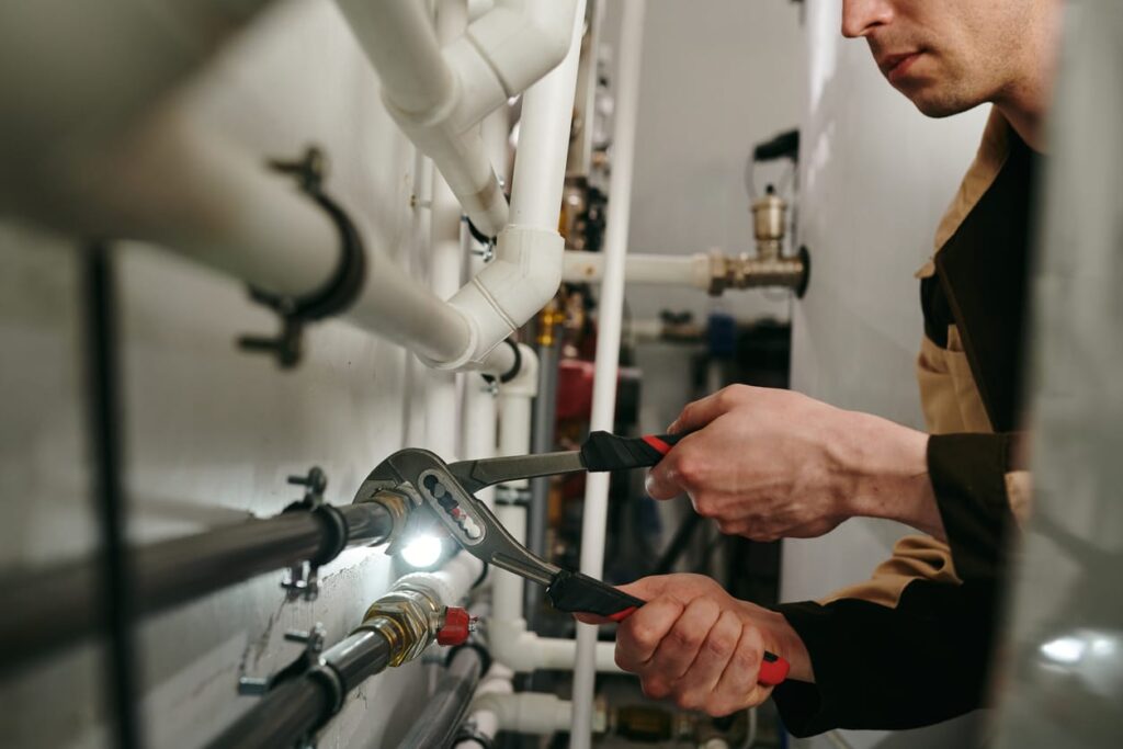 Plumbers maintaining commercial plumbing pipes in Cape Coral