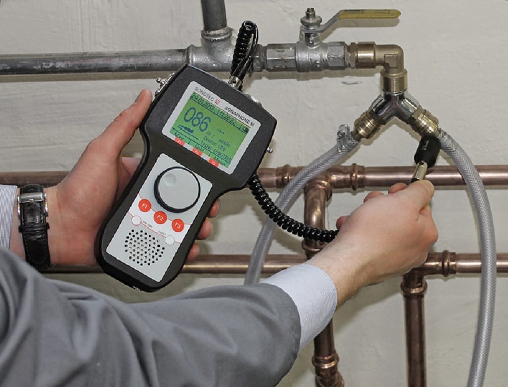 Plumber testing pipes with electronic leak detection equipment in Cape Coral