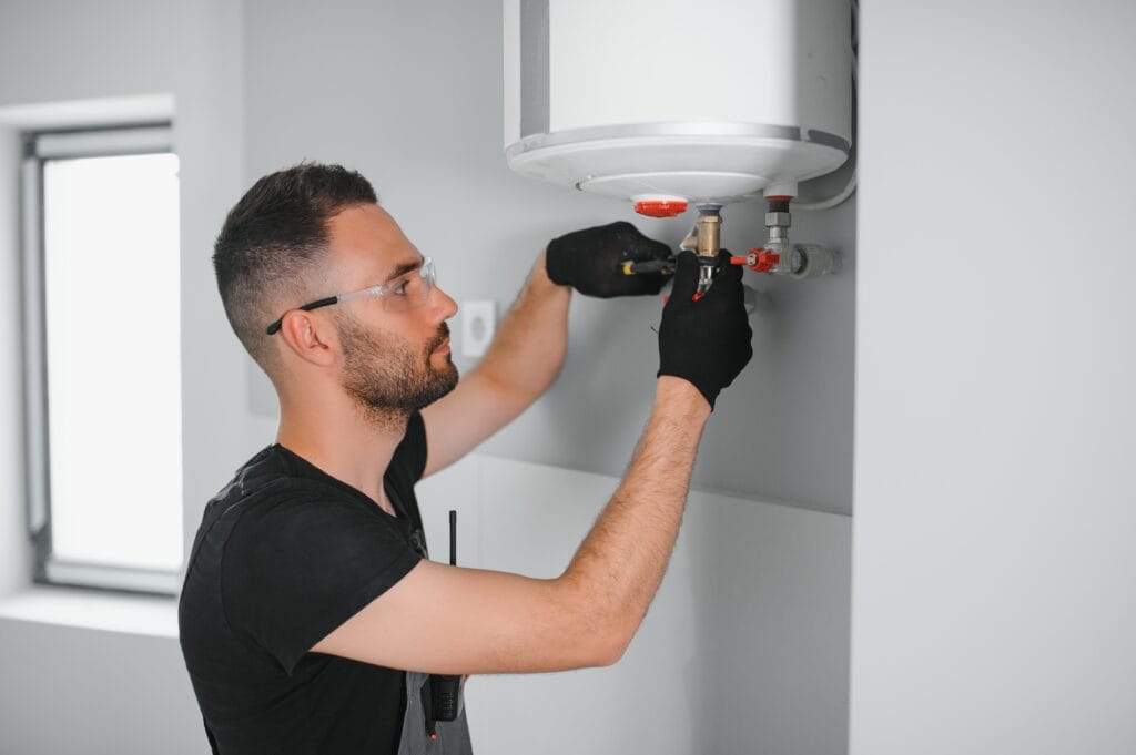 Technician performing water heater maintenance in Cape Coral